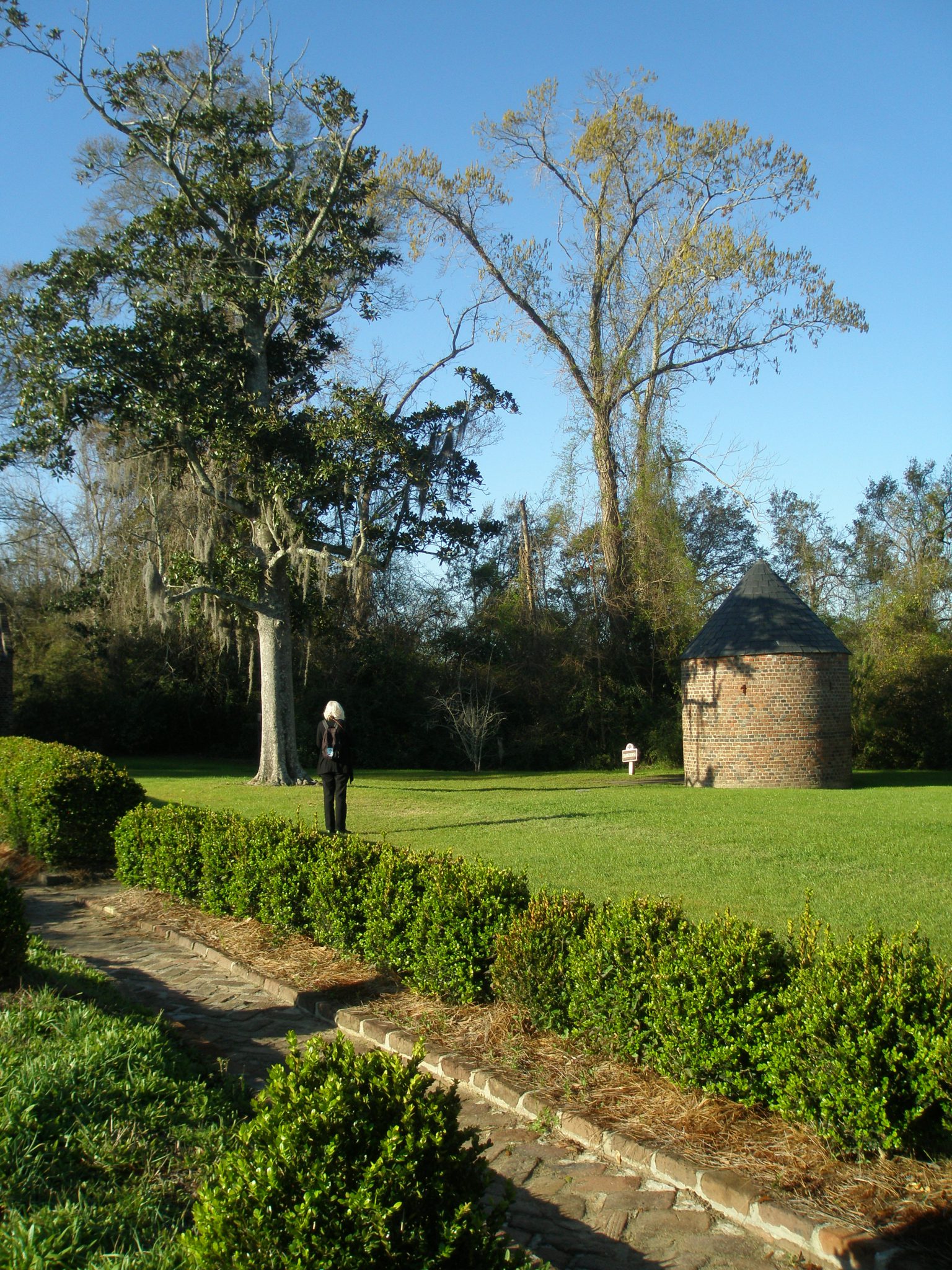 Donn inspects the Smoke House, which is the oldest structure at the Plantation