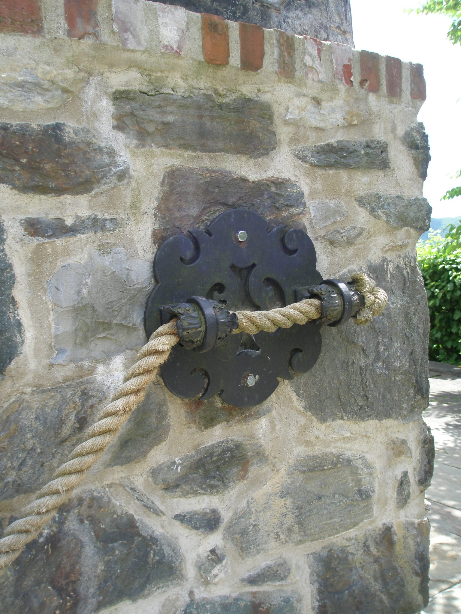 Rope Bannister and Ornate Steel Medallion near the Top Lawn