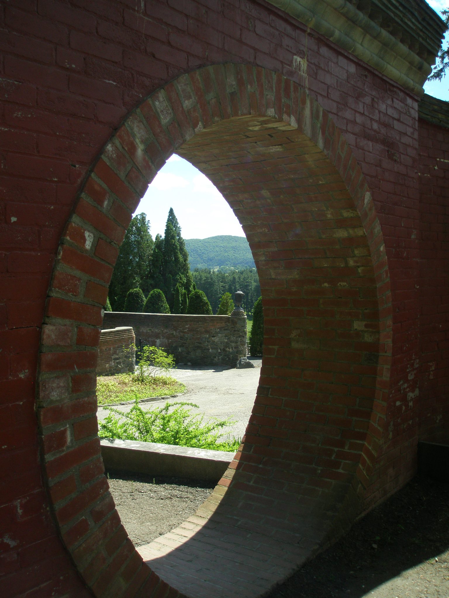 View through the Moon Gate, out toward the Arborvitae Walk, and the Western hills.