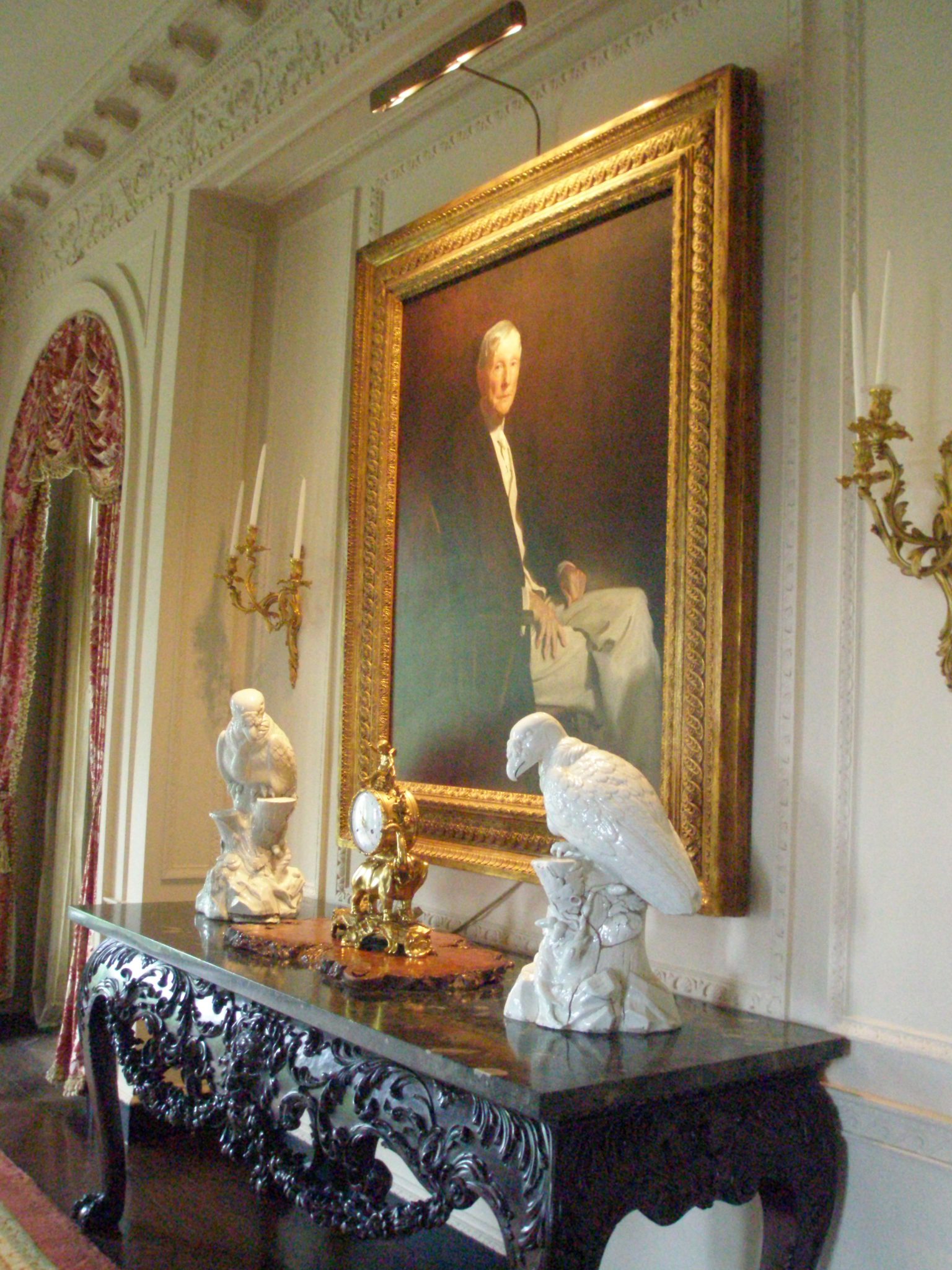 Dining Room, with John Singer Sargent's portrait of JDR, painted in 1917. Flanked by two massive Meissen birds (c.1734)