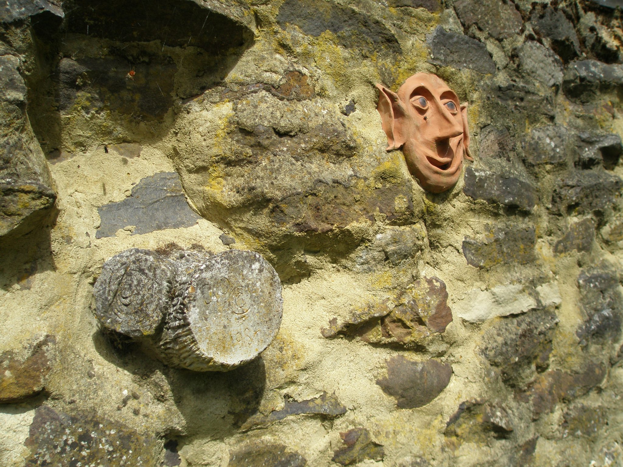 Faux Bois, and a Garden Sprite, mortared into a Ruin Wall