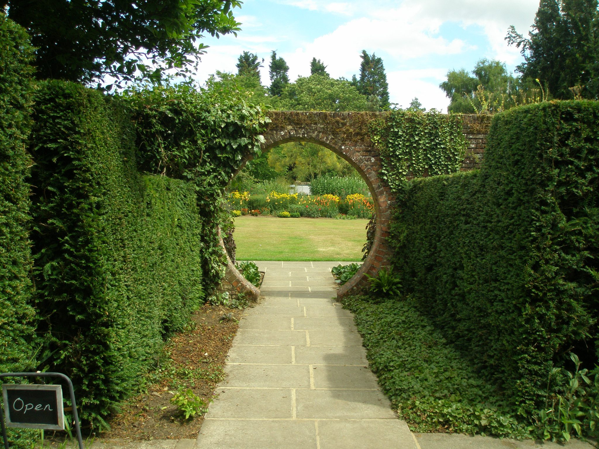 Halfway down the Memorial Garden Walk, this Moon Gate frames a view of the Square Walled Garden, which was built in 1840.
