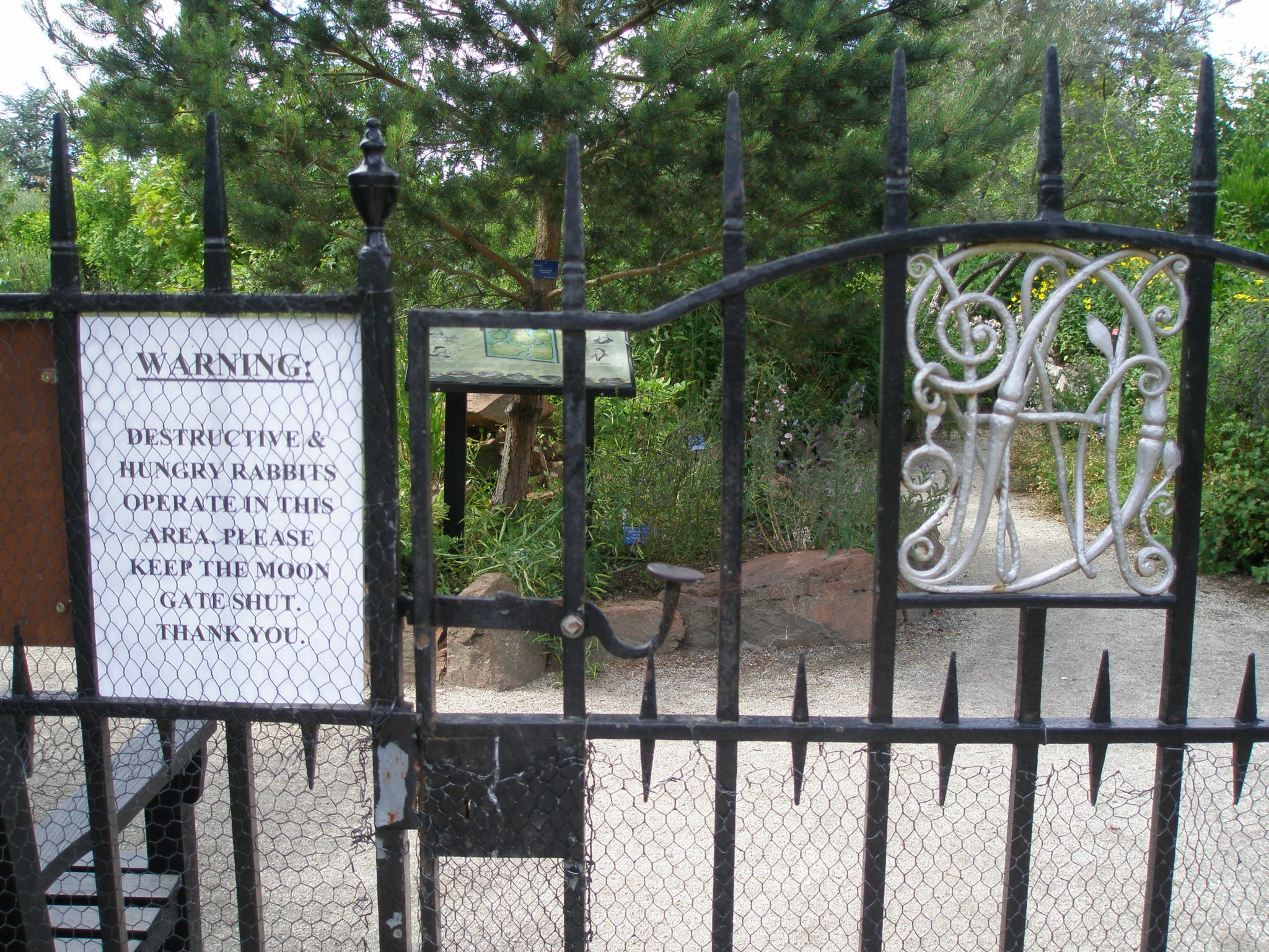 At the Moon Gate Entrance to The World Garden: Beware the Hungry Rabbits. The United Kingdom is just inside the Gate. The British Isles beds contain Scottish Caledonia Pine and Butcher's Broom