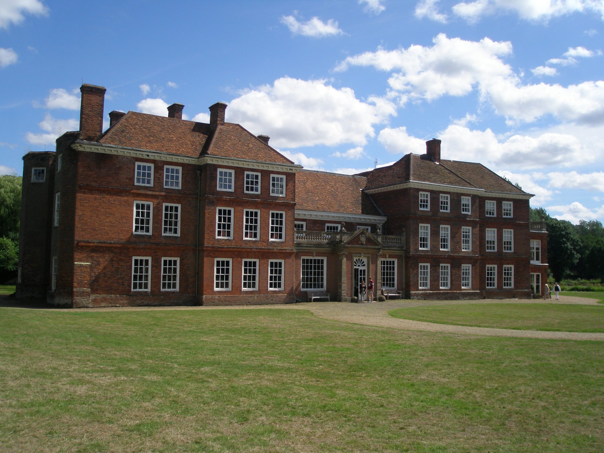 The West Front of Lullingstone Castle is opposite the Gate House. The facade, done in the Queen Anne style, was added in the mid 18th century. The Manor House was originally surrounded by a moat.