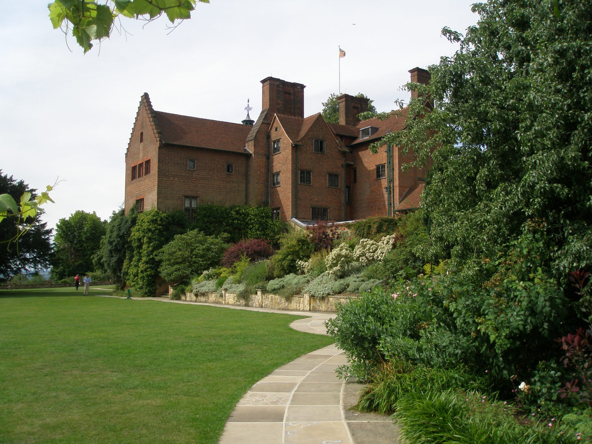The view from the Terrace Lawn, up toward the back of the House. After Churchill bought Chartwell, his architect Philip Tilden built a new wing, which extended out into the garden. The 3 stories of this addition contained a Dining Room on the garden-level basement, a Drawing Room on the ground floor, and a barrel-vaulted bedroom for Clementine on the first floor. Ever-dramatic, Churchill called his addition "my promontory."