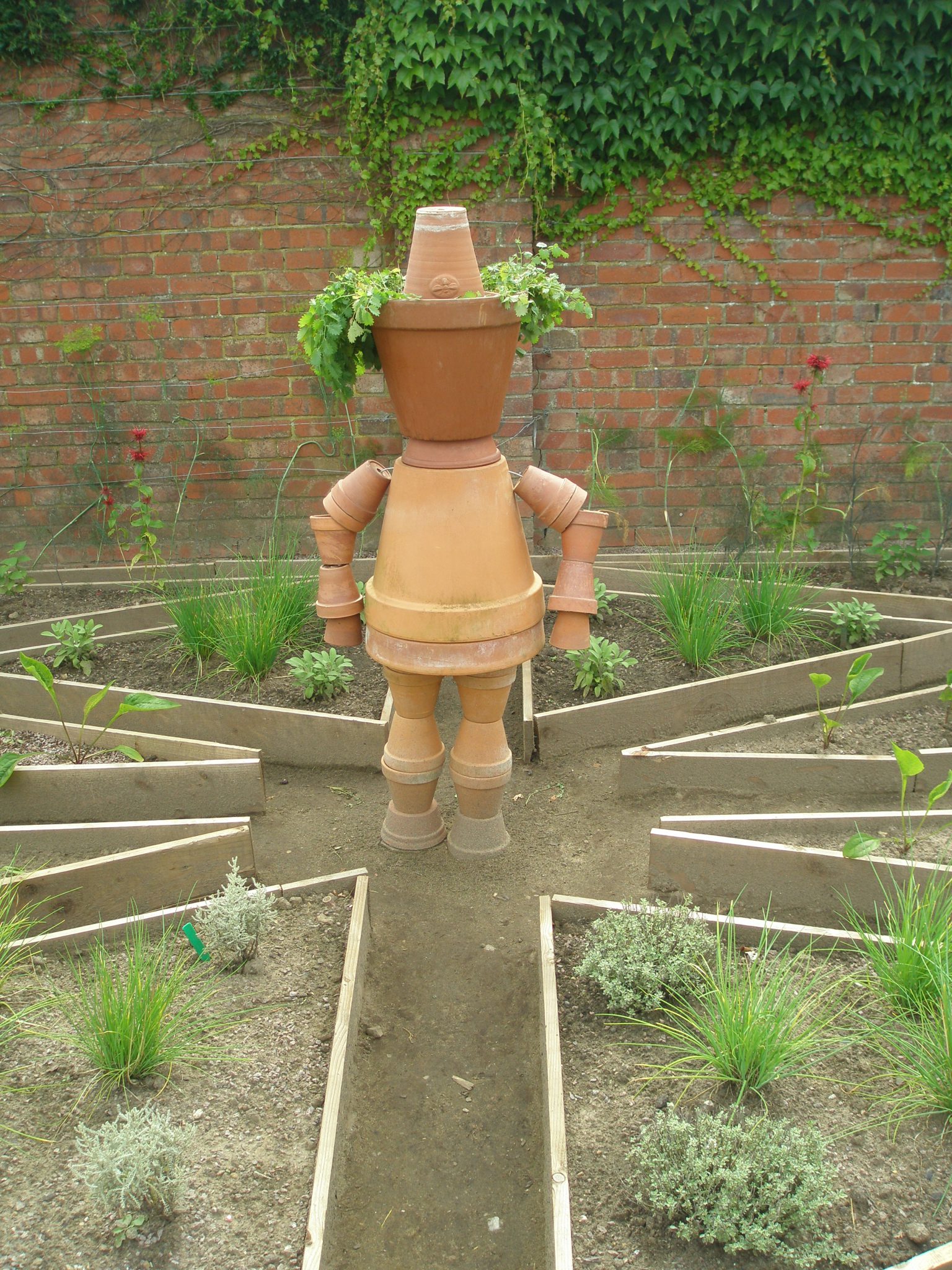 A clay-pot Scarecrow....not very scary.
