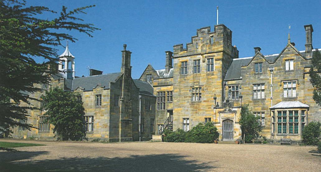 The New House at Scotney Castle was built in an Elizabethan-Revival Style, from 1837--1843. On the Entrance Front, a battlemented tower dominates. The walls are built with a striated, golden sandstone, which was dug from the quarry that's immediately below the House. Image courtesy of The National Trust.