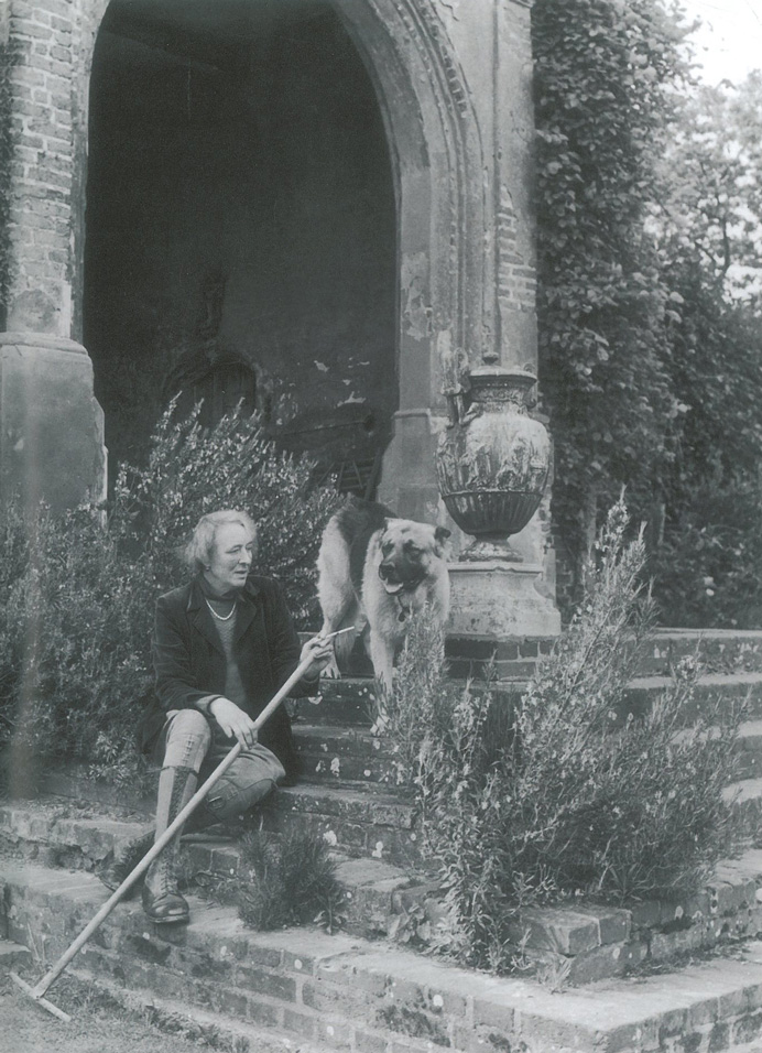 Vita Sackville-West, after WWII, on the Tower Steps, with Rollo. Image courtesy of The National Trust.
