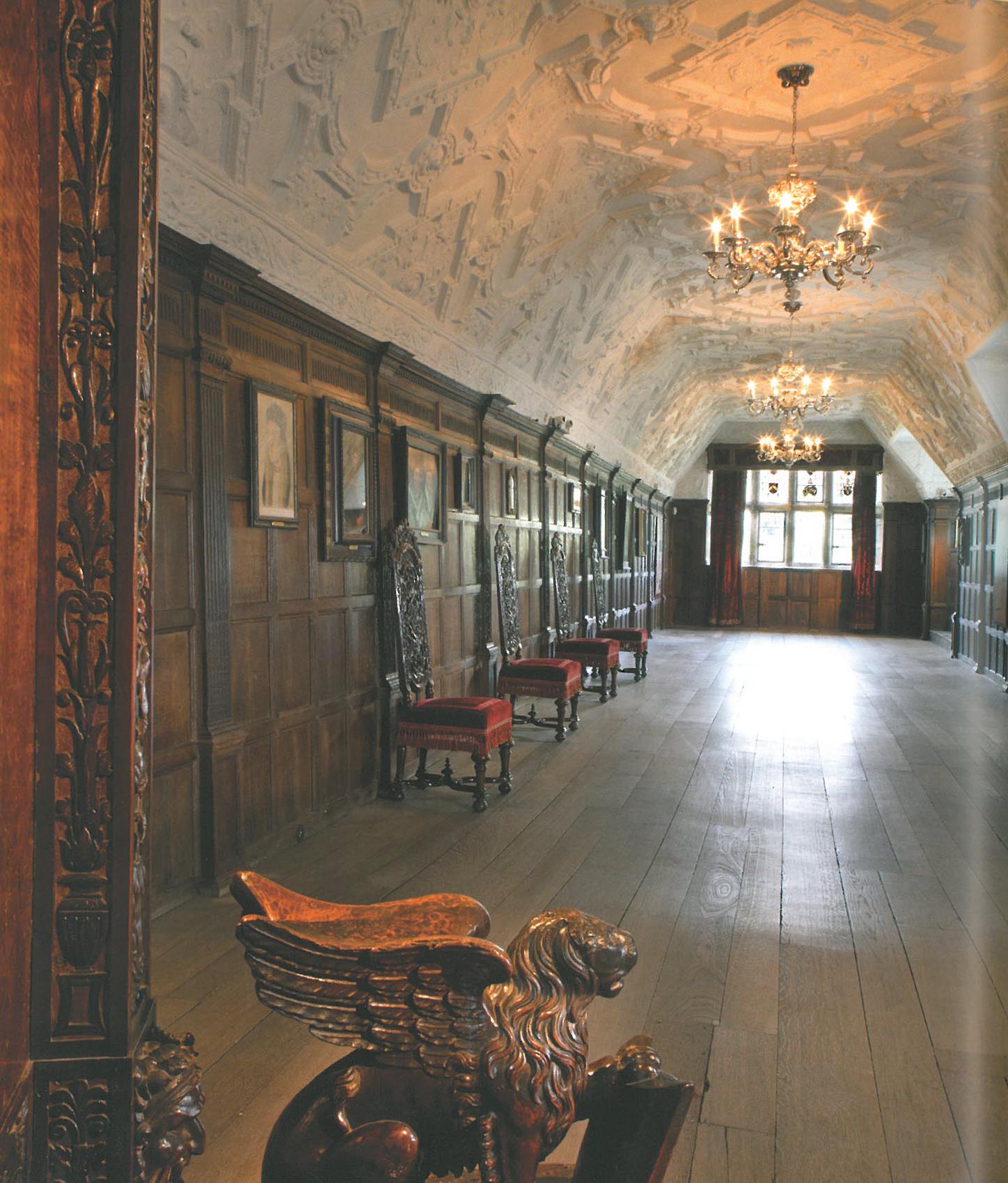 The Long Gallery is more than 98 feet long and runs the entire width of the building. This was added by Thomas Bullen in 1506, and was used for entertaining, displaying art, and taking exercise during inclement weather. The paneling is Elizabethan, and the ceiling is a 16th century style reproduction made for Astor. Tradition says that Henry VIII held Court in the alcove at the far end of the Long Gallery when he visited Hever Castle. Image courtesy of Hever Castle.