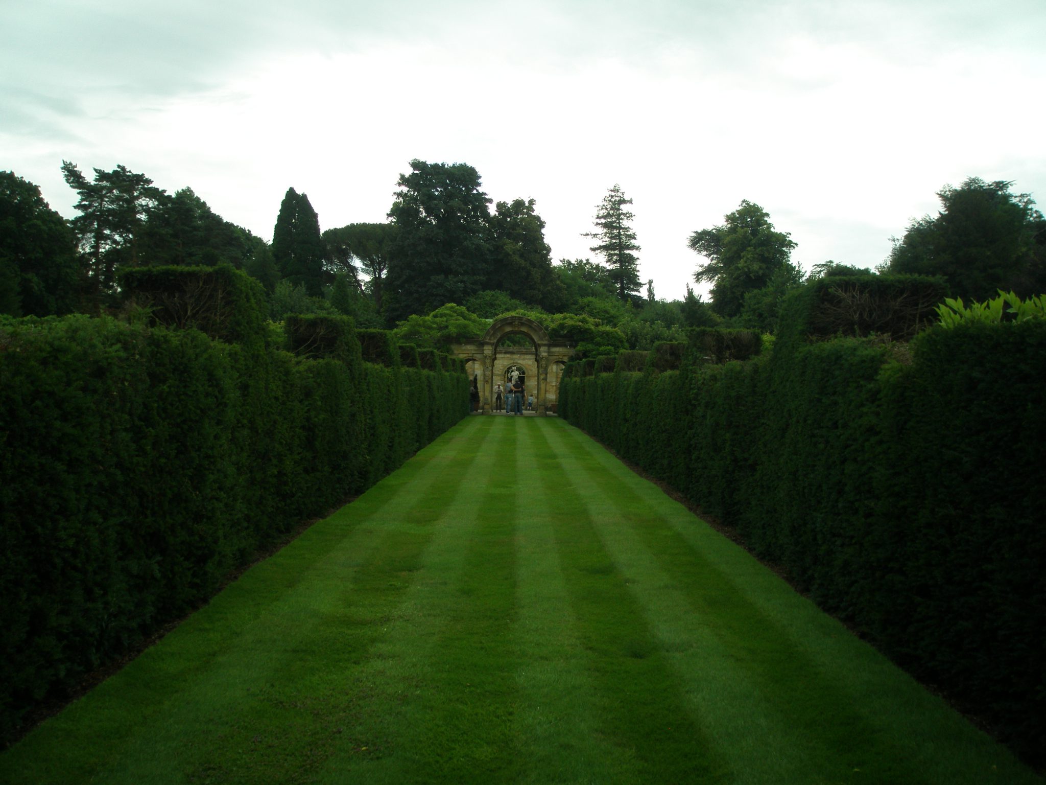 A cross-wise path bisects the long green of the Italian Garden