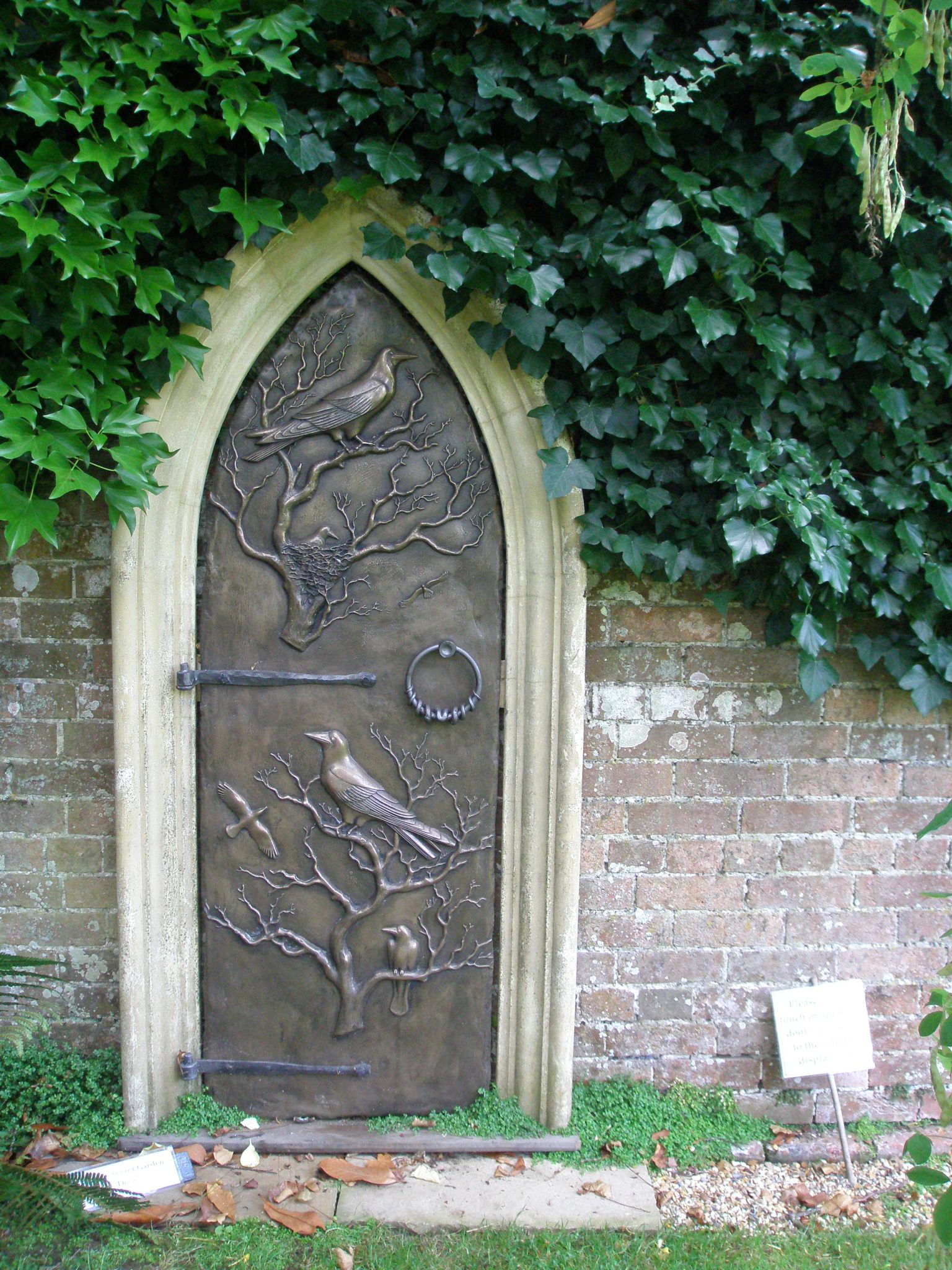 A bronze Door to Nowhere, on the Rose Garden Wall