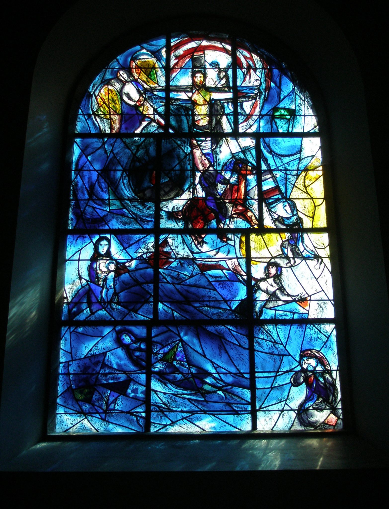 Chagall's Memorial Window, at All Saints Church, in Tudeley. The blue-ish light that's reflected against the walls around the lower portions of the window seems to splash real sea-spray into the air.