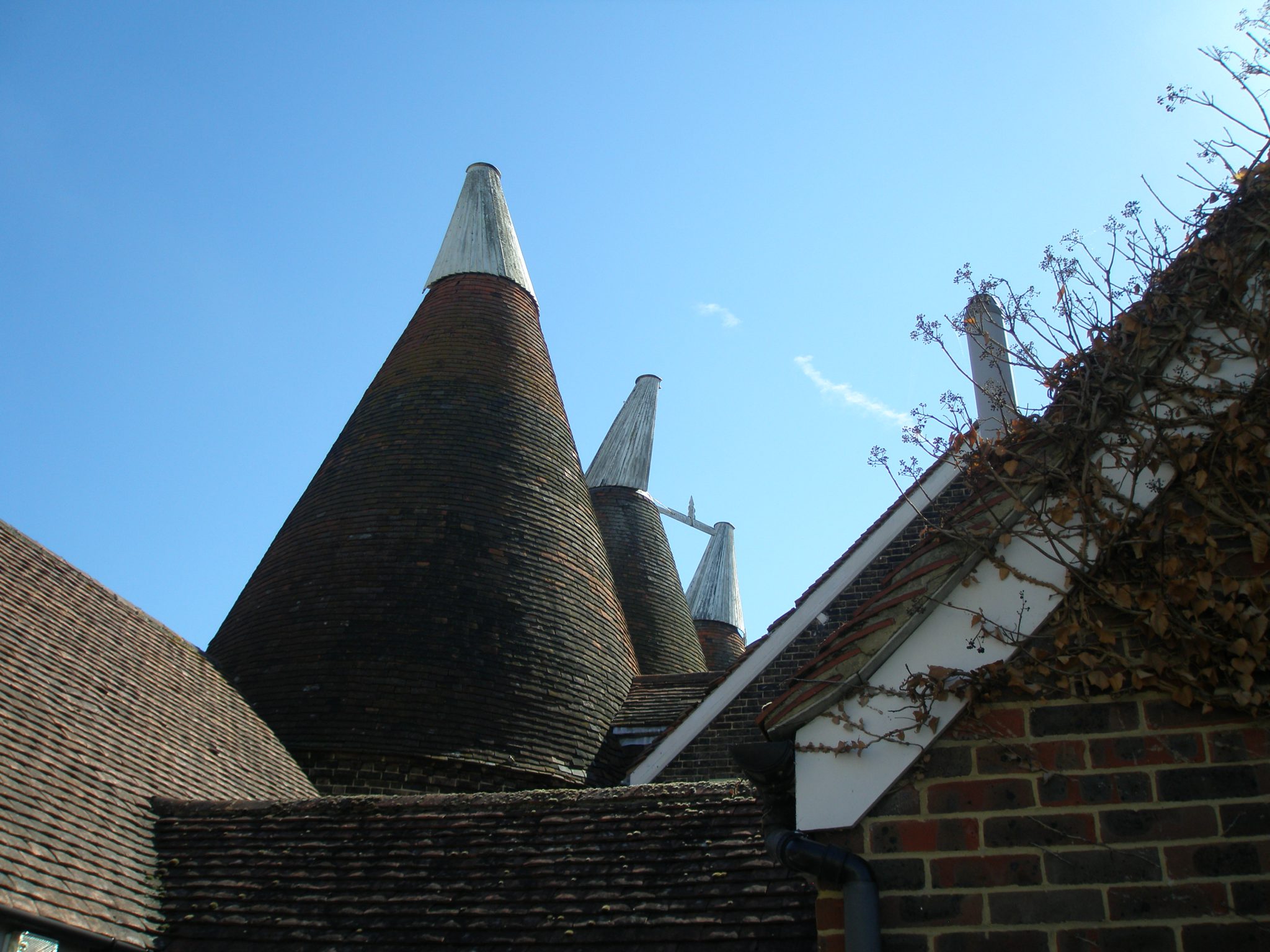 Oast roofs consist of: Roundel, Hot Air Outlet, Wind Vane, & Cowl.