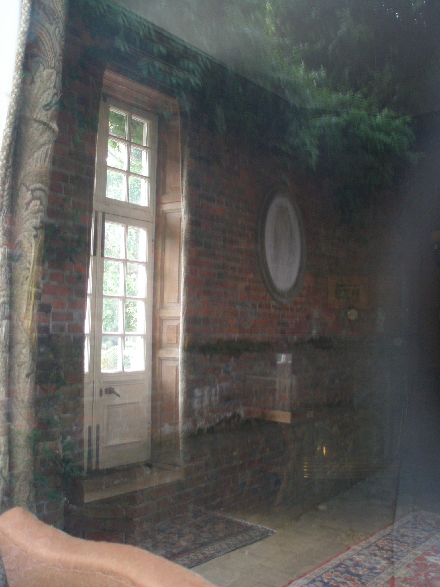 I peered through Lamb House's parlor window, and got a glimpse of these French doors, which lead to the private garden (yes...I'll photograph that, when I'm back in Rye).
