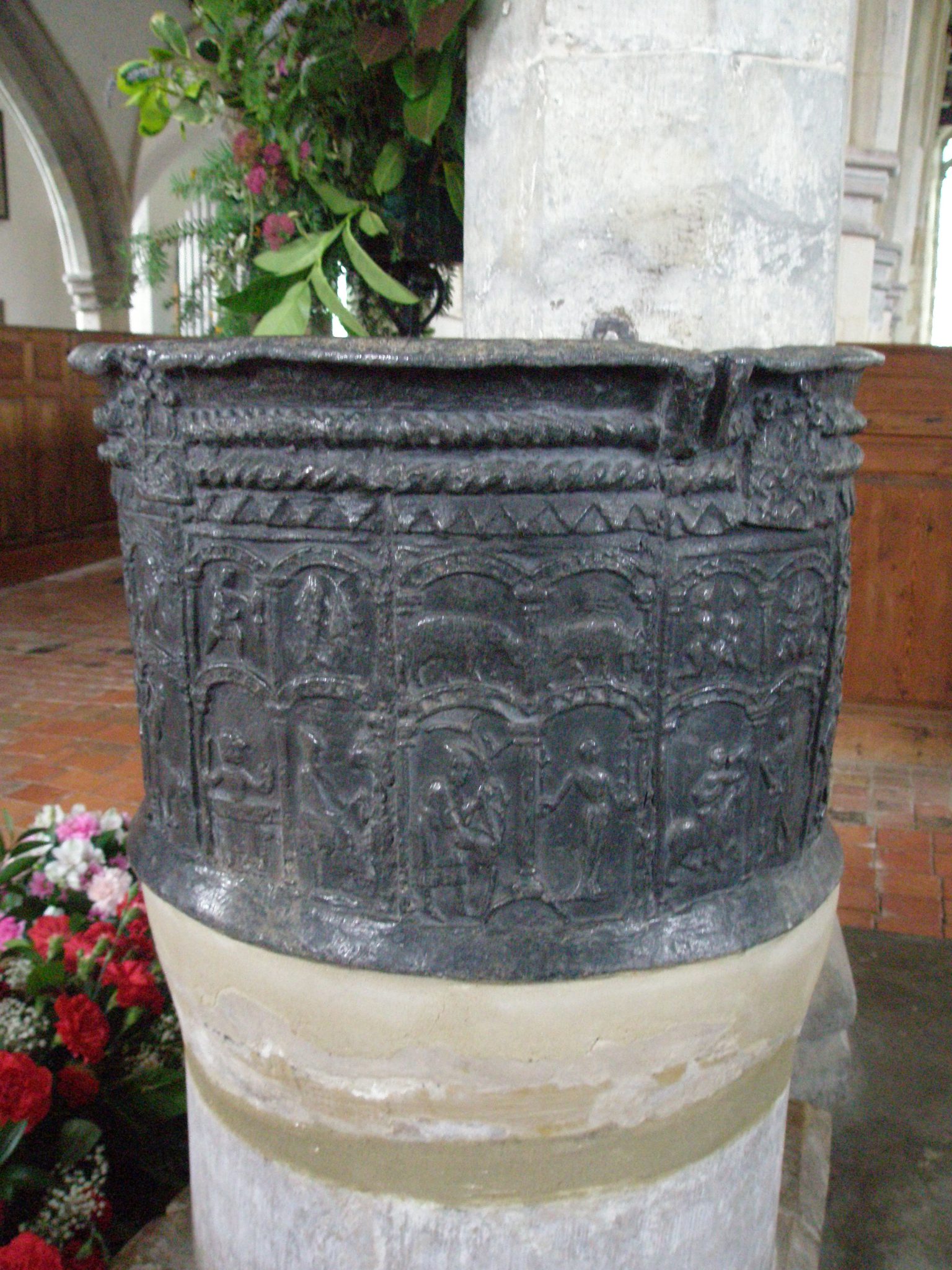 The Font is decorated with 12 panels showing the signs of the Zodiac, which are accompanied by images of the typical labors of each month.