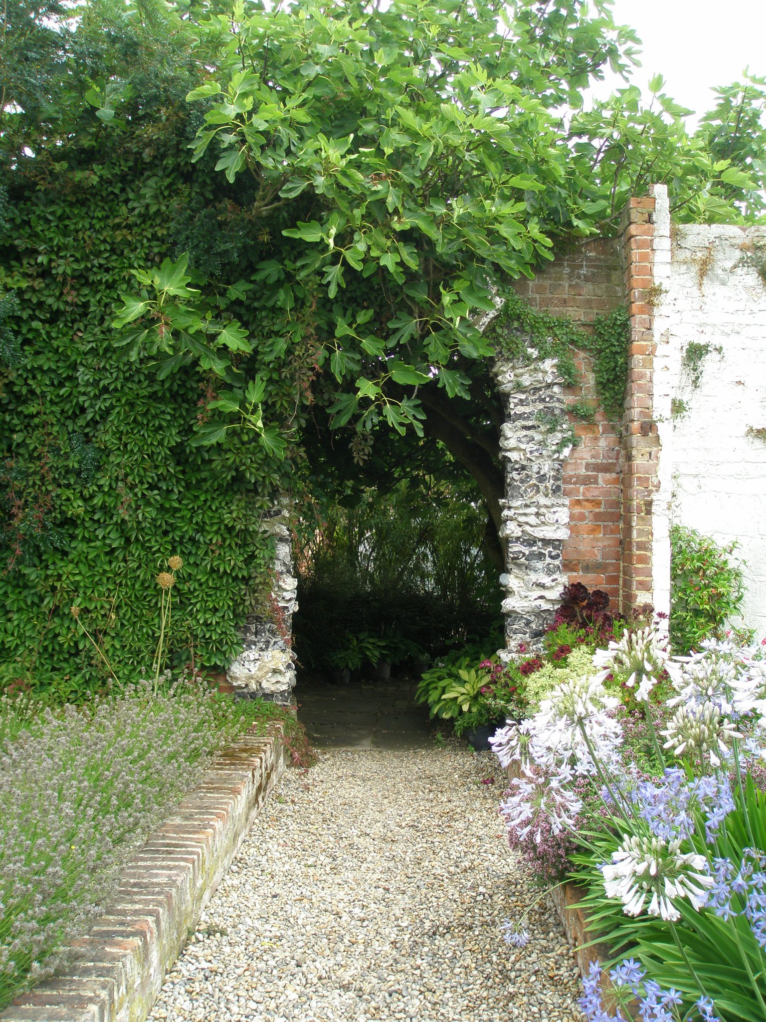 One of the rare curiosities in the Walled Garden is this flint-decorated archway.