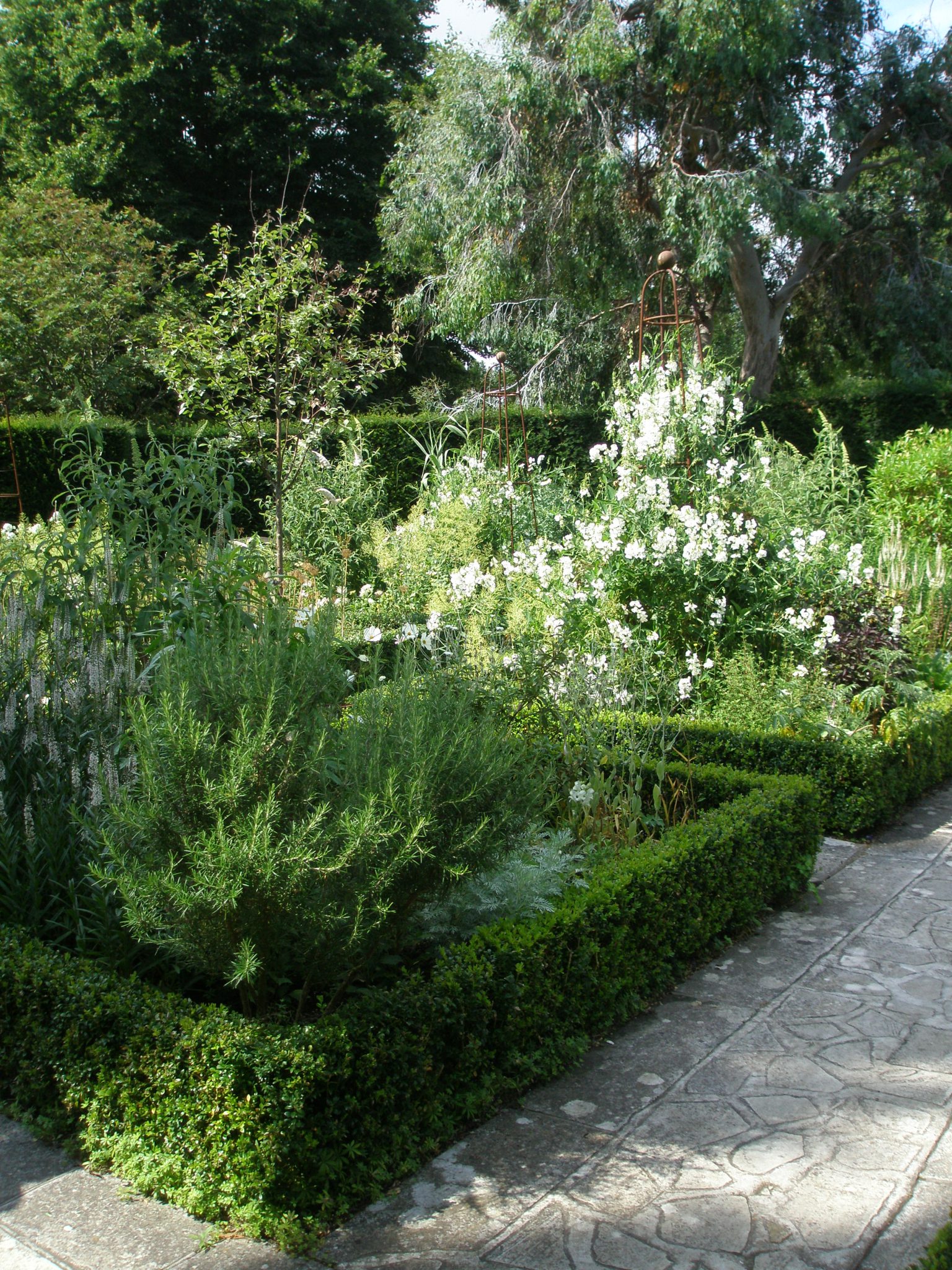 Shoe-horned into the most-pointed space on the property is the Circular White Garden