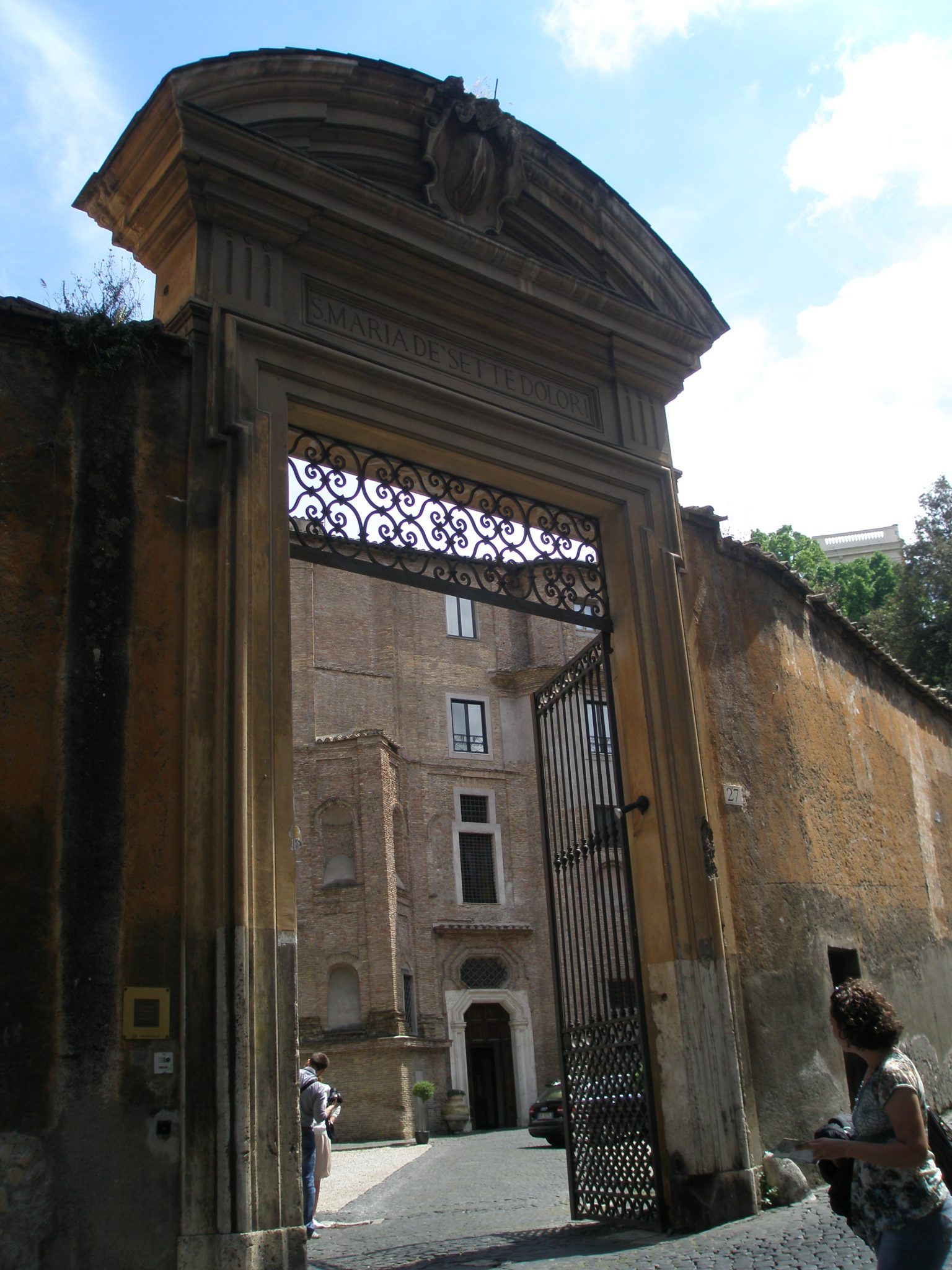 The imposing Entry Gate to the Donna Camilla Savelli Hotel's front courtyard, as seen from via Garibaldi.