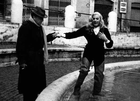 During rehearsals, Fellini helps his Star into the Trevi Fountain.