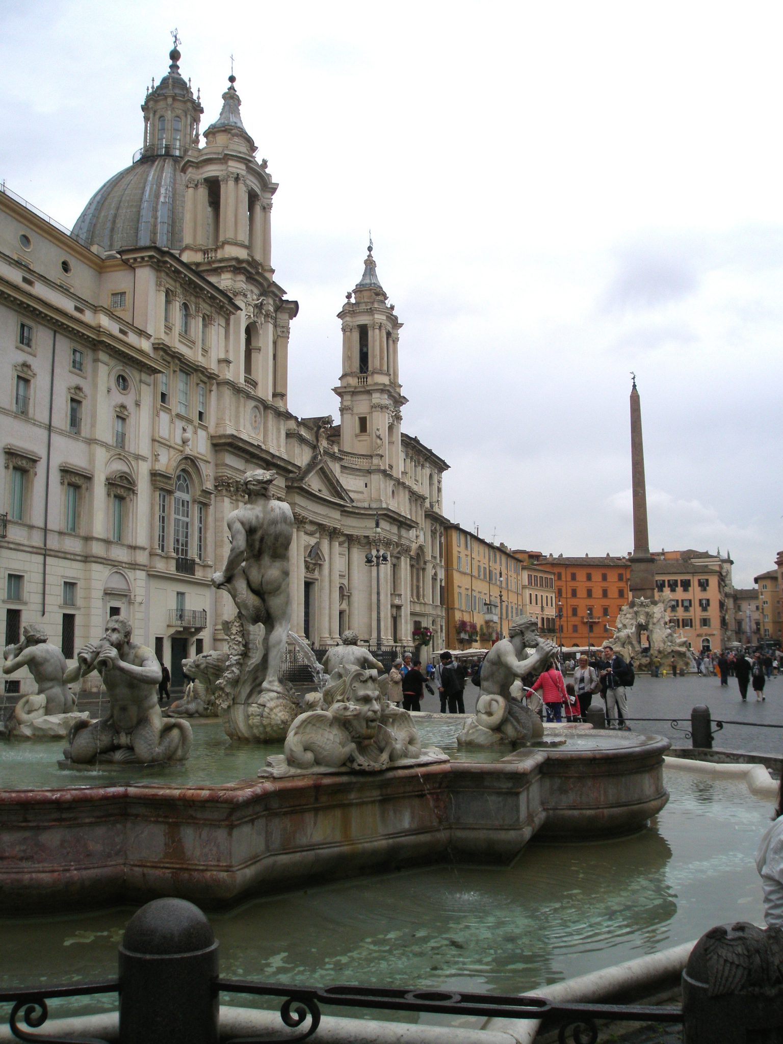 The Fontana del Moro, with its 4 Tritons, was made in 1576 by Giacomo della Porta. Bernini gussied things up in 1653, when he added the central figure, who rides a dolphin.