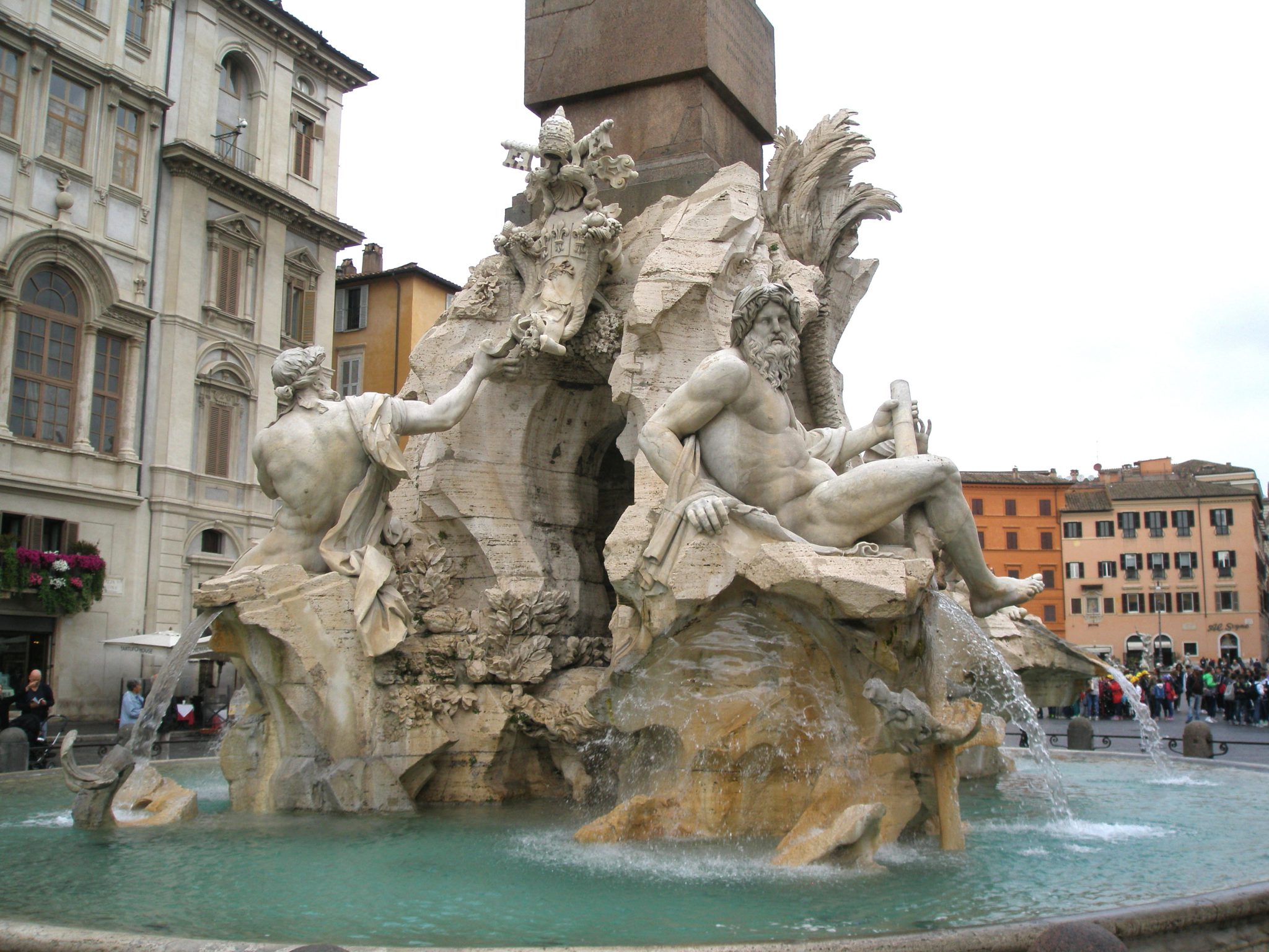 Bernini's Fountain of the Four Rivers, in the rain. The south-facing figures: on the left, The River God of the Danube; on the right, The River God of the Ganges.