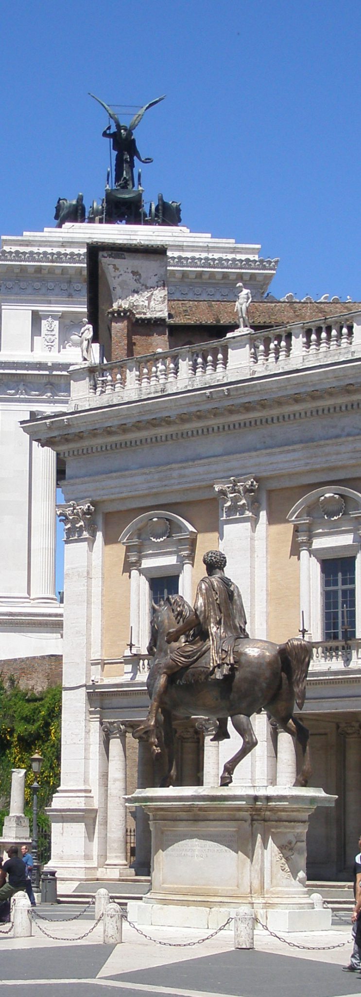 The reproduction of Marcus Aurelius in the foreground, with one of Il Vittoriano's giant, winged statues overhead.