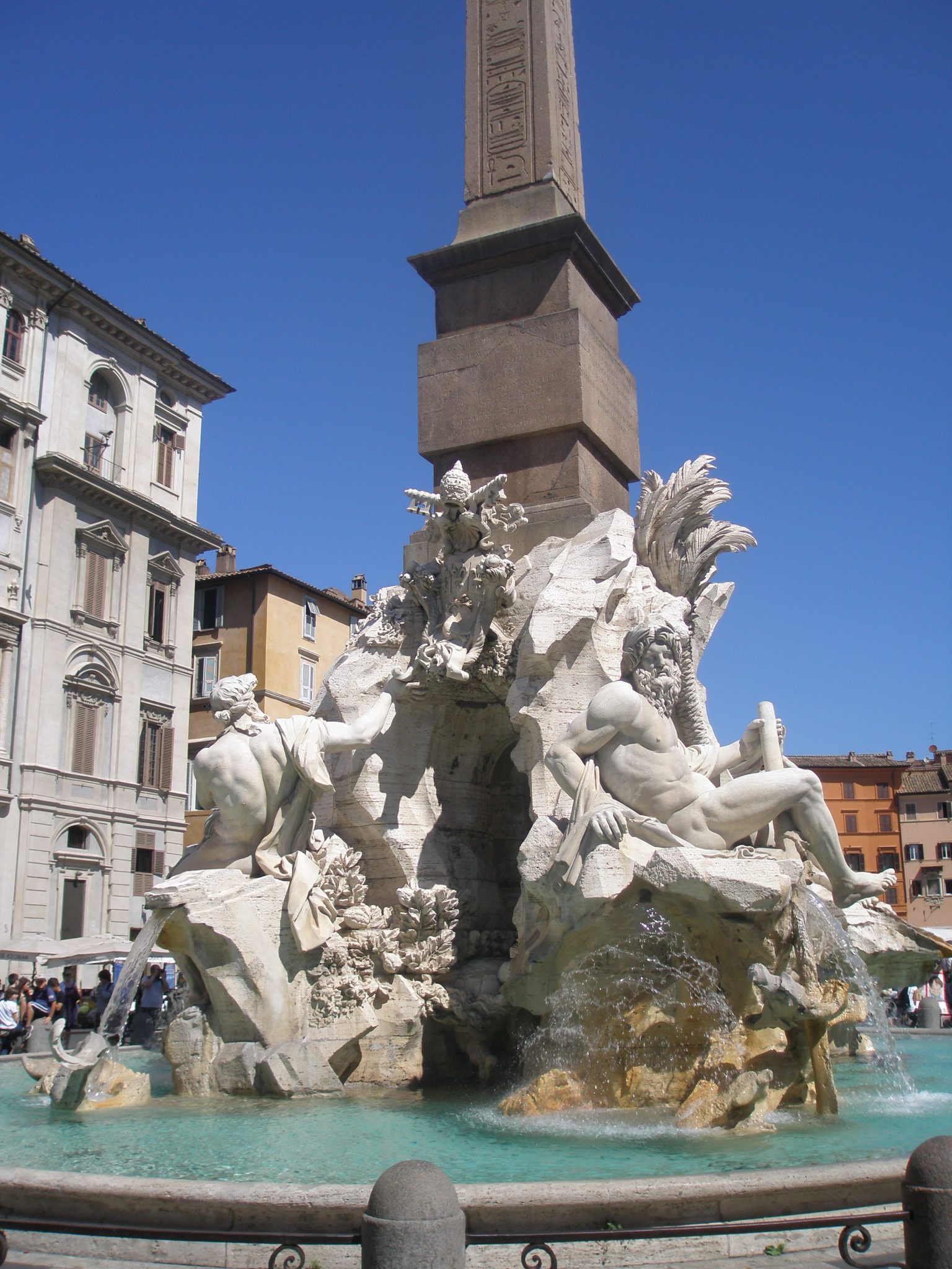 Fontana dei Quattro Fiumi (Fountain of the Four Rivers). Completed in 1651, by Gian Lorenzo Bernini, and his assistants. I took this photo on a postcard-sunny day, in June of 2011.