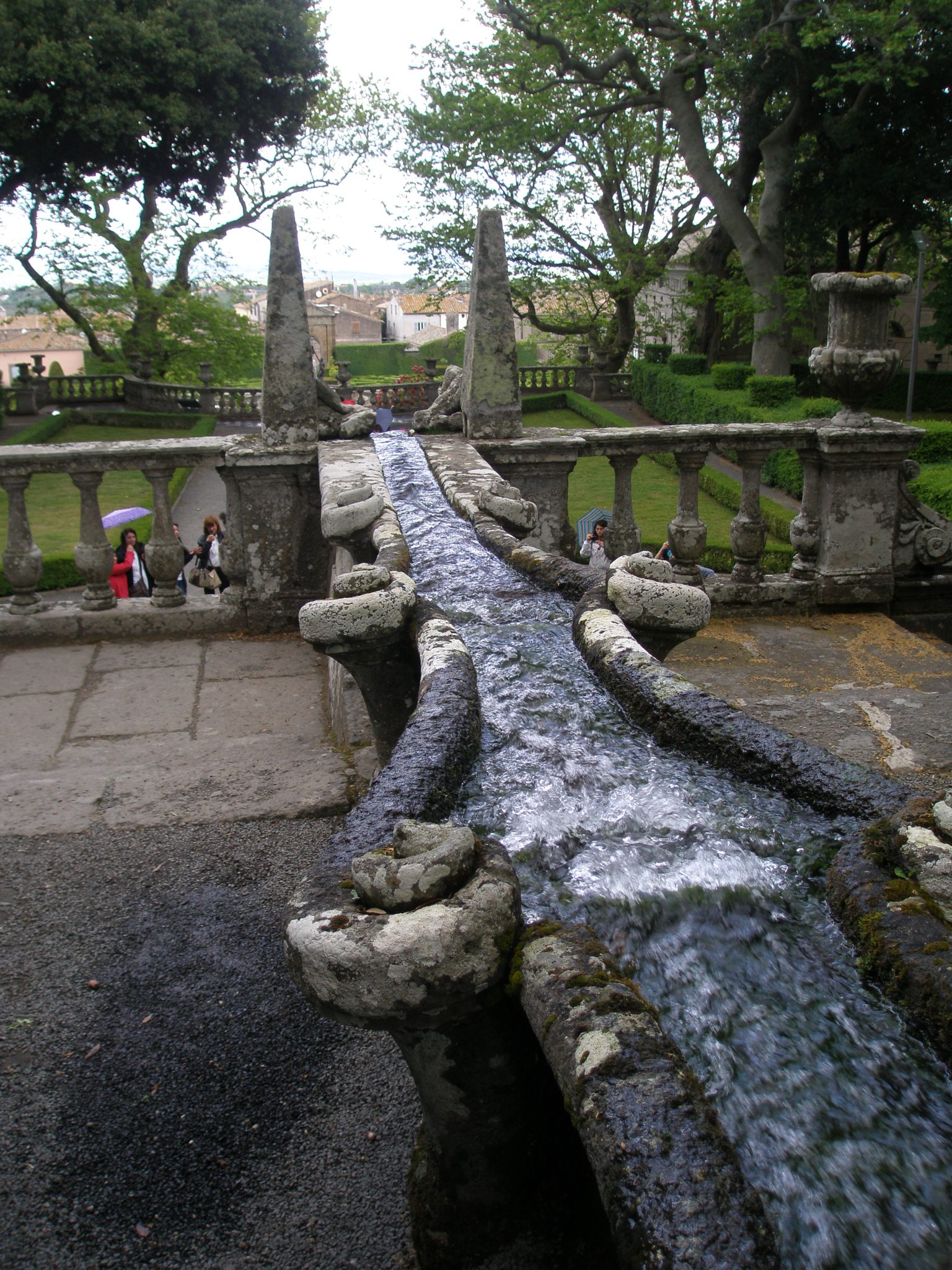 Two Obelisks mark the lowest point of the Water Chain. Directly below the balustrade is the Fountain of the Giants (or Rivers).