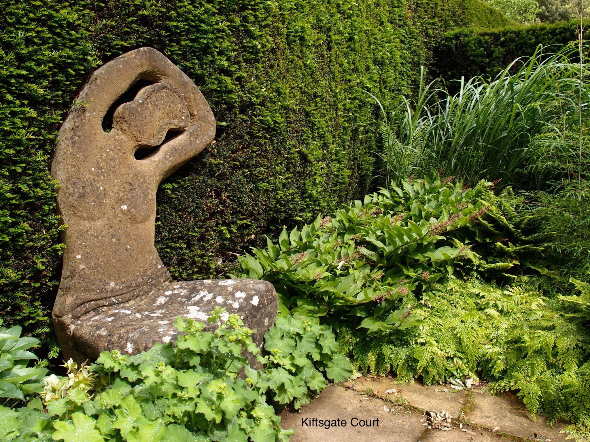 This Stone Lady serves as a chair, in a secret garden that's adjacent to the new, Water Garden.