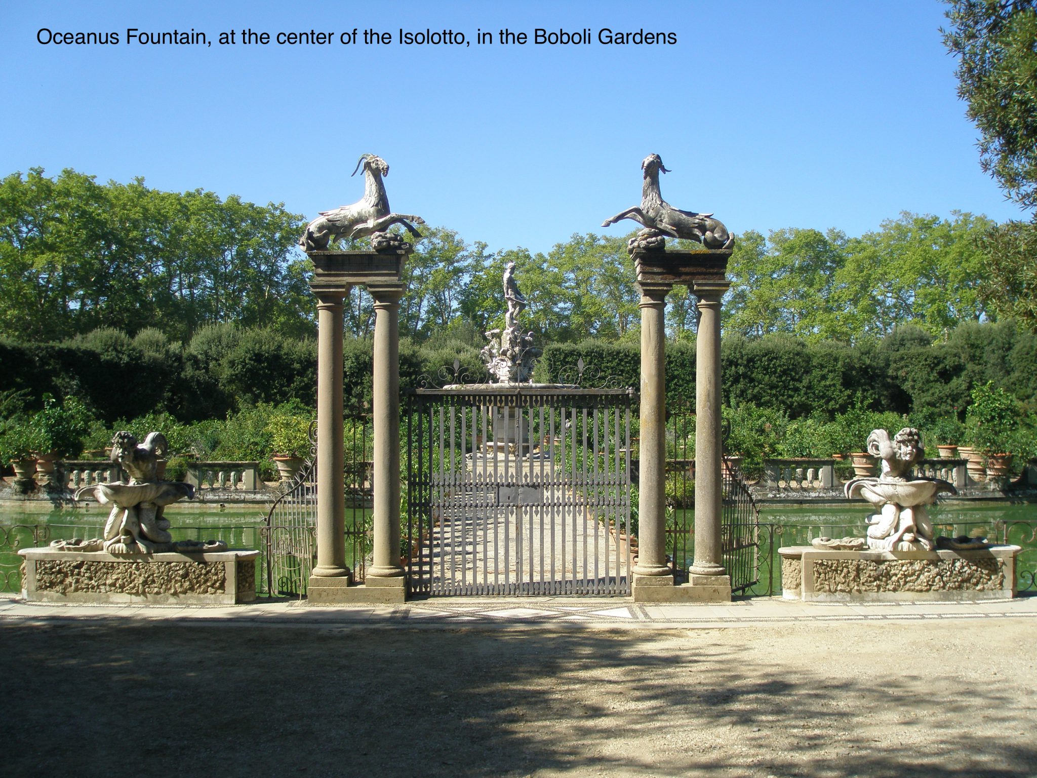 Behind locked gates in the Boboli Gardens, the massive Oceanus Fountain looms.