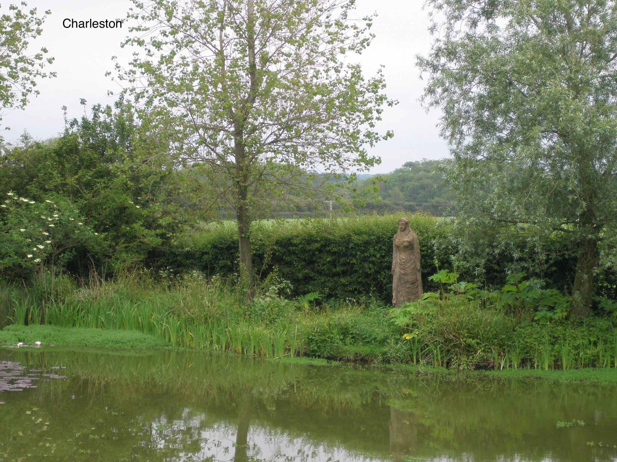 Quentin Bell's tall FEMALE FIGURE, on the far side of the pond, was made in 1954.