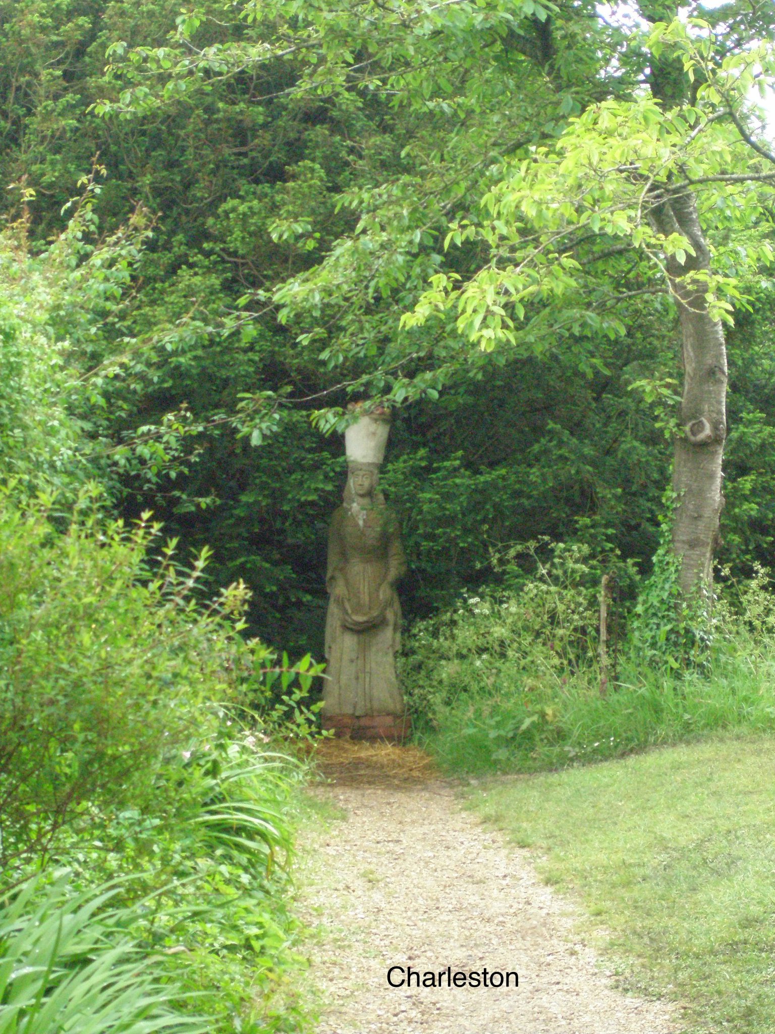 And Quentin Bell's statue of POMONA, also made in 1954, guards a path to the Orchard. Pomona is a Roman goddess, and the keeper of fruit trees.
