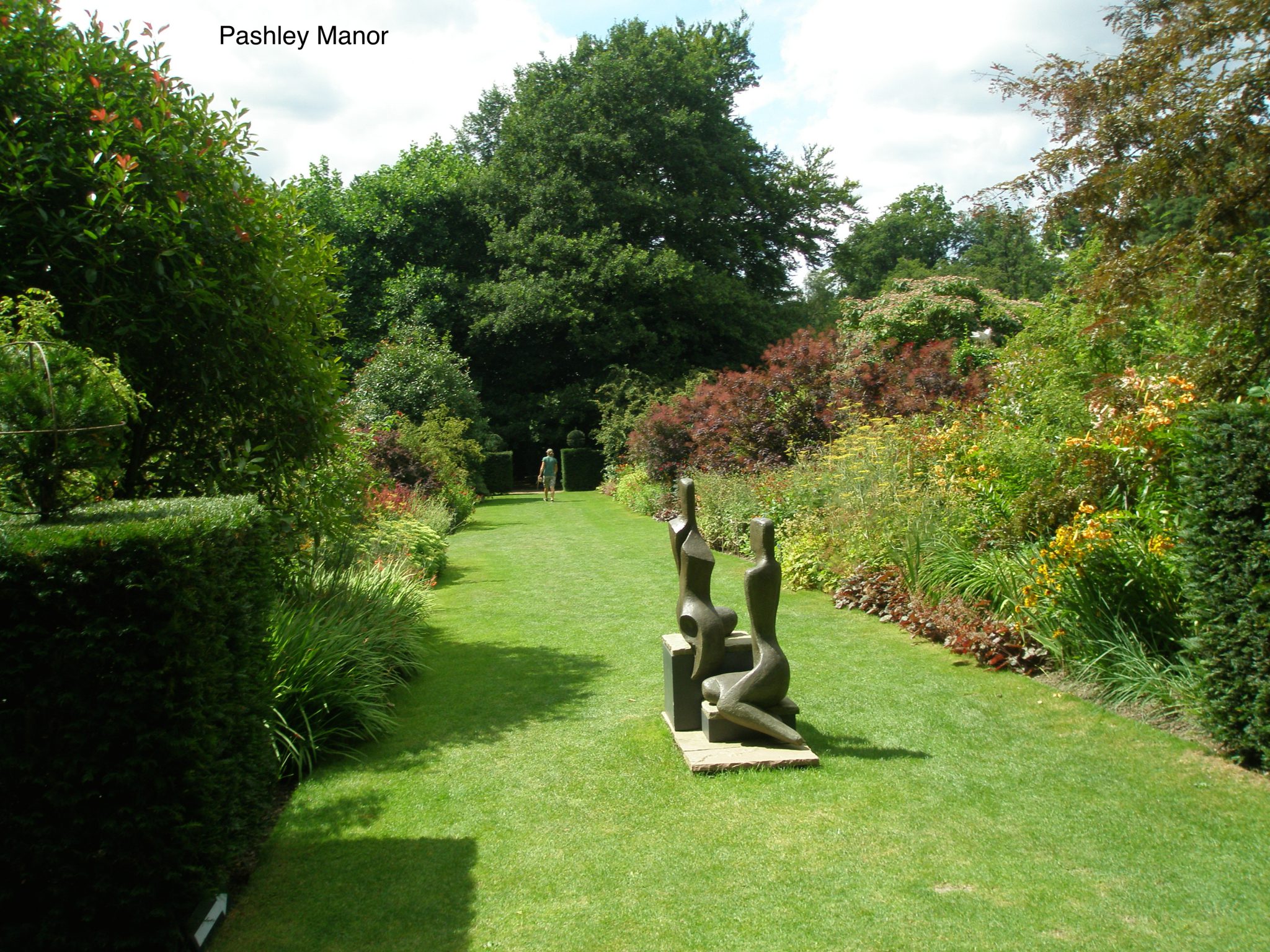 Sculpture on a grass path welcomes us. (Note: Pashley Manor is another of the many gardens that Blue Badge Guide Amanda Hutchinson and Chariot-Driver Steve Parry have taken me to. And in July of 2015, Amanda and Steve and I will resume our touring; this time concentrating upon Surrey, and East Sussex...and with a bit more of Kent, thrown in for good measure). Amanda's contact info can be found in the Borde Hill section of this Diary.) 