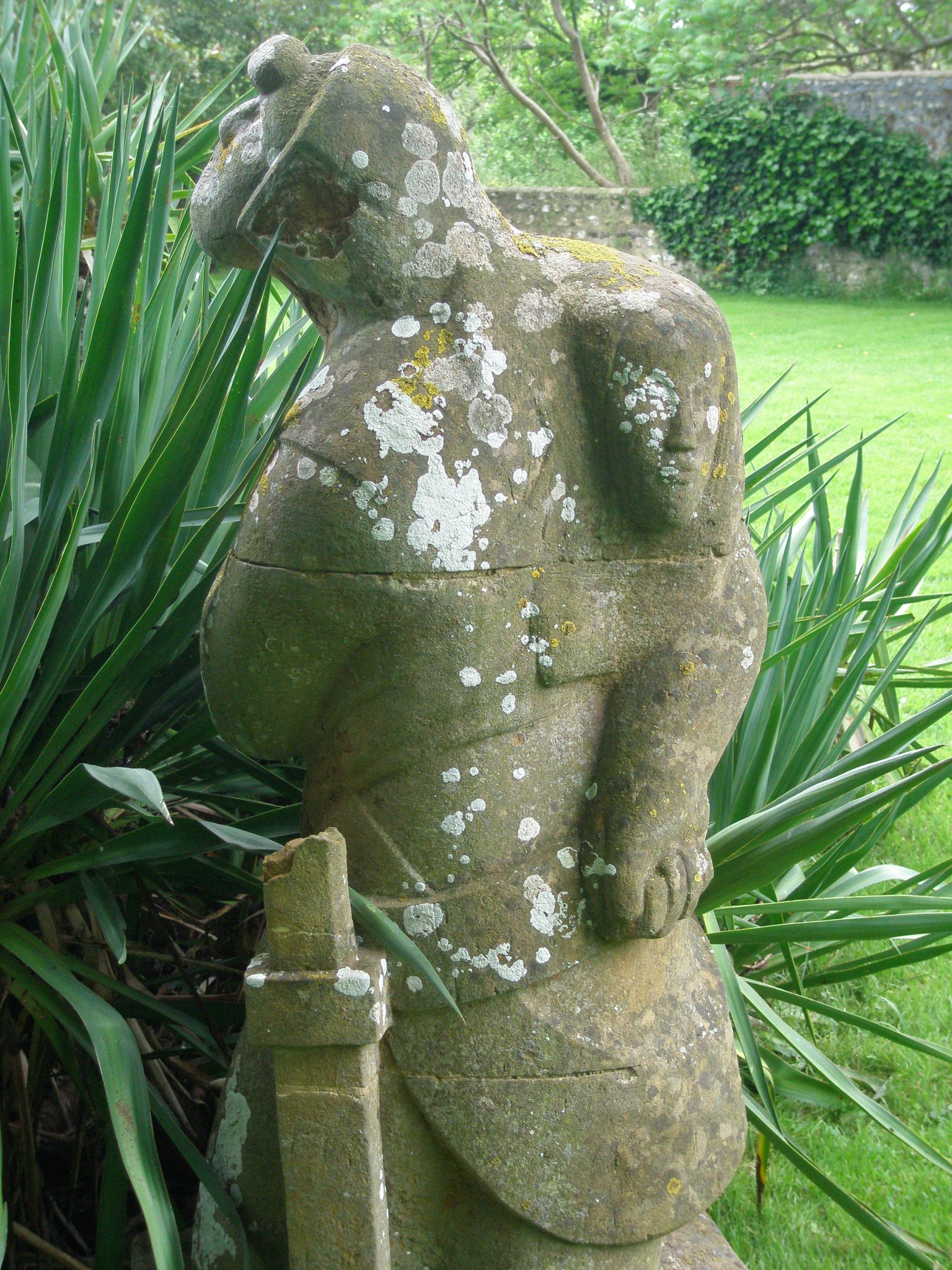 Statue, overlooking a pond, in the garden at Monk's House