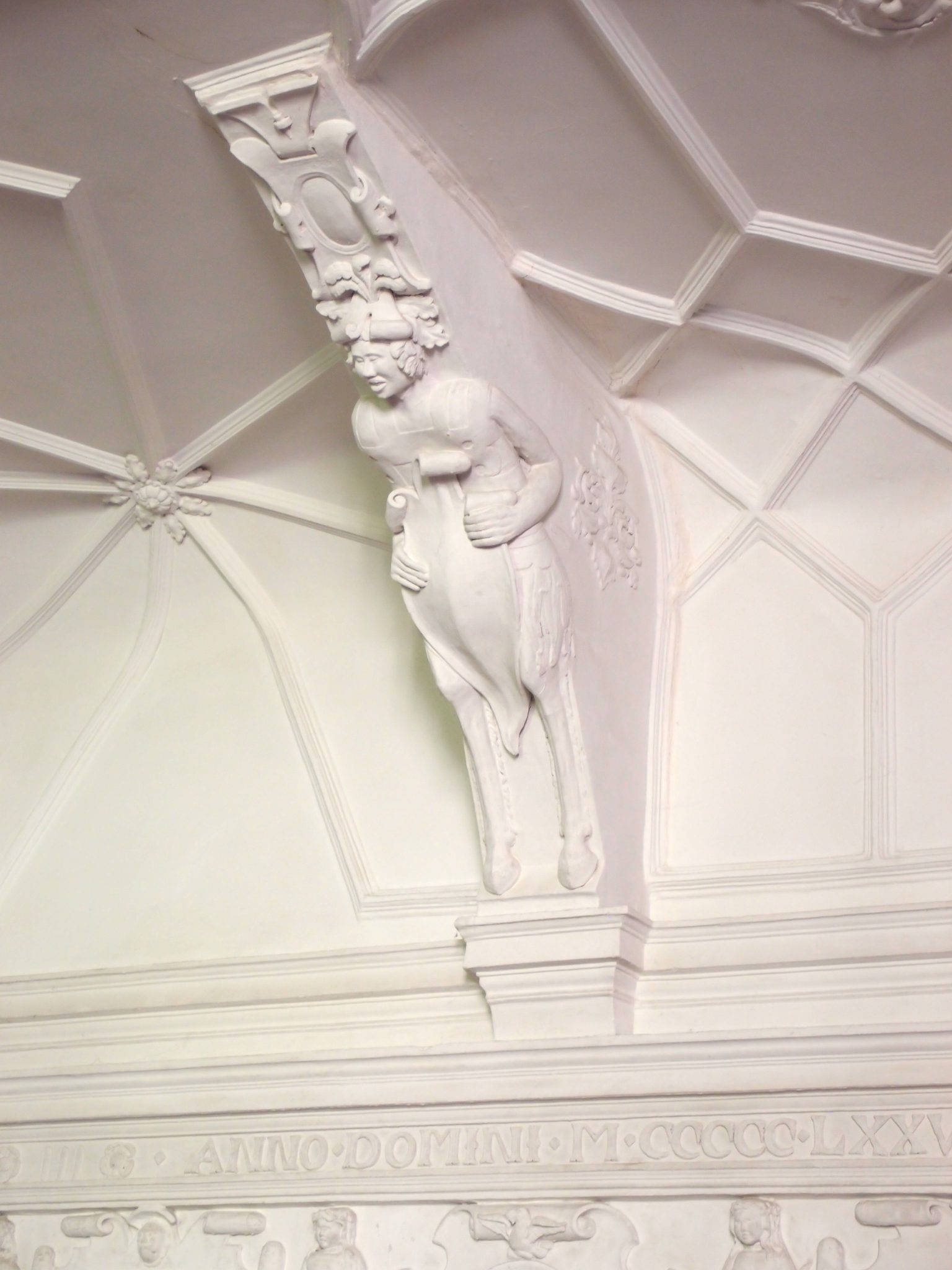 The Great Hall's ceiling is supported by shield-bearing satyrs.