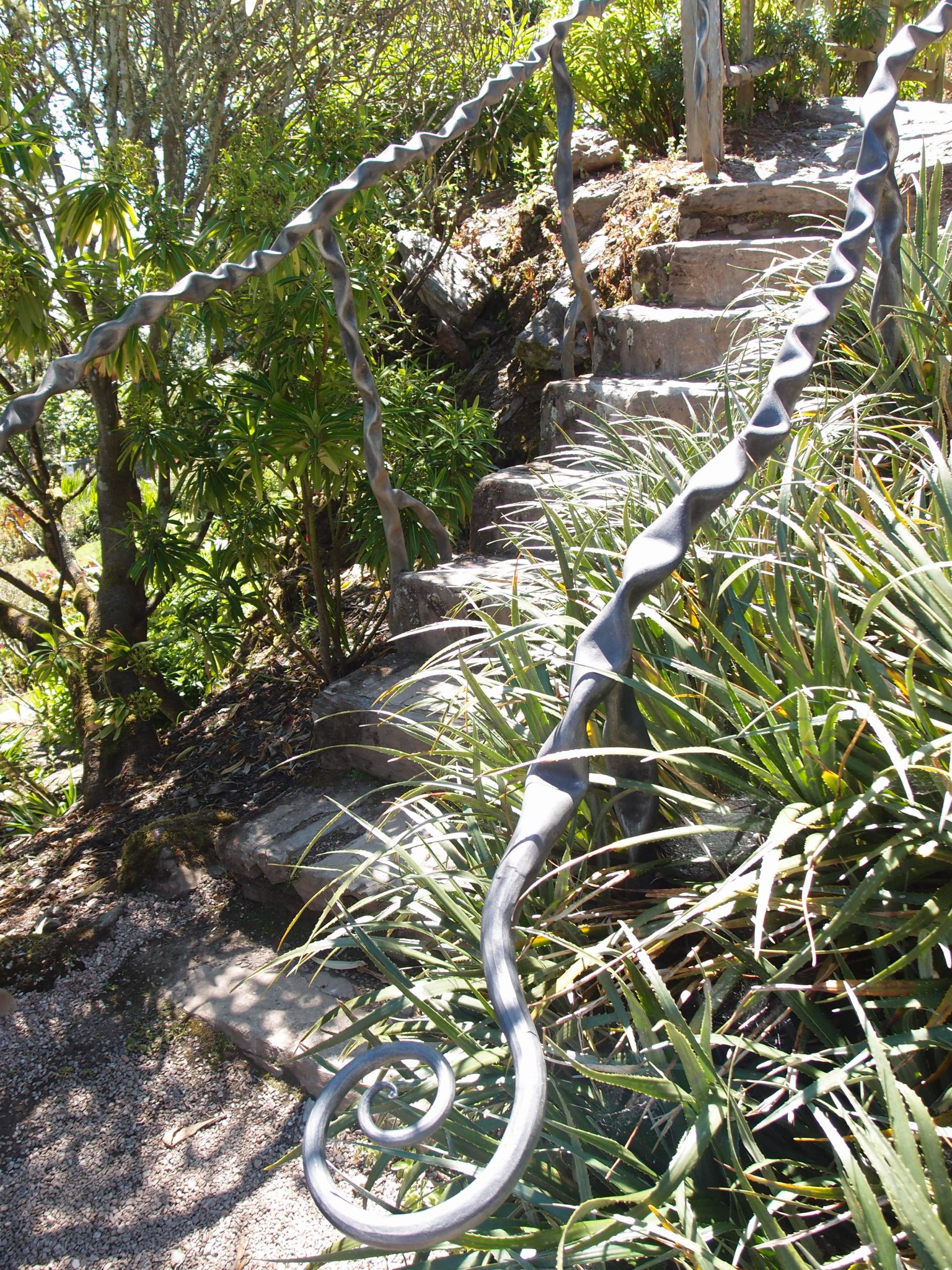 A flight of stairs in the Rock Dell leads up, toward the Olive Grove & Picnic Area.