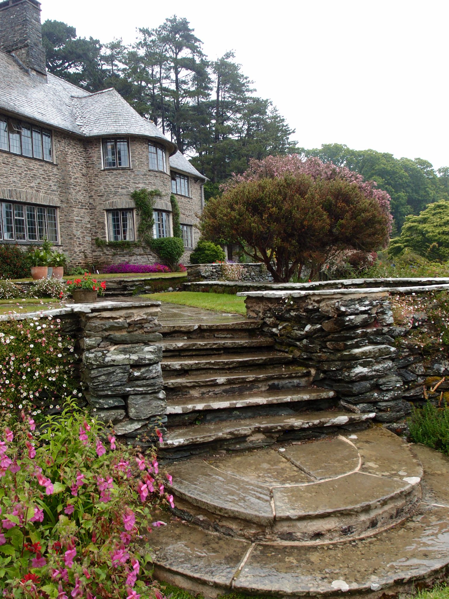 By the southwest corner of the House, a cascade of steps connects the Top and Middle Terraces.