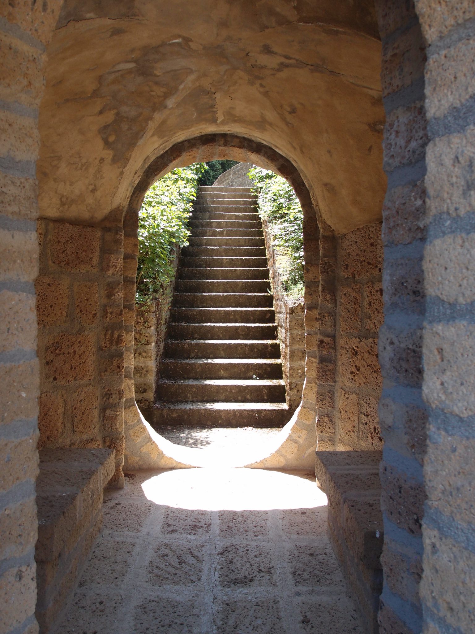 A beautifully-formed passage through the base of the Ruined Column. The stairs lead uphill, to a portion of the Ideal City which we must still visit.