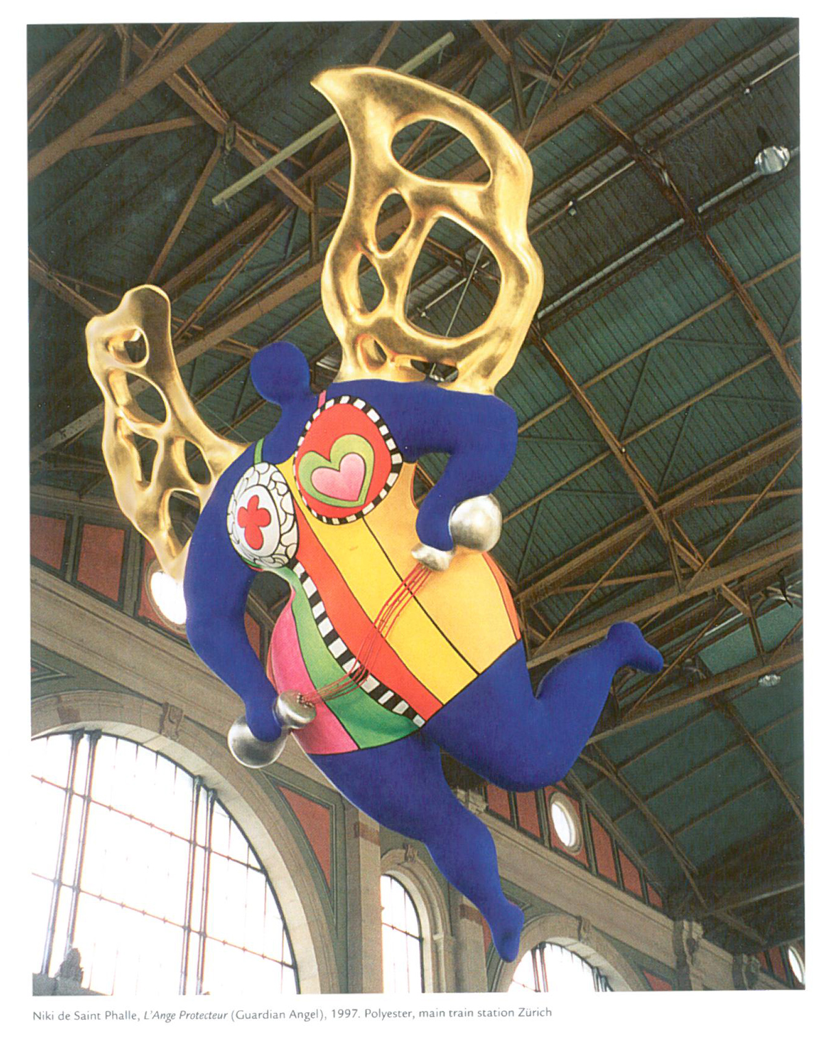 Niki de Saint Phalle’s L’ANGE PROTECTEUR. This enormous sculpture of painted polyester, which weighs 1.2 tons and is more than 36 feet high, hangs in the rafters of Zurich’s main railway station, and was made in 1997 by Niki to guard travelers. Image courtesy of Il Fondazione Giardino Dei Tarocchi. 